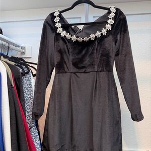 Elegant Black Dress with Floral Embellishments